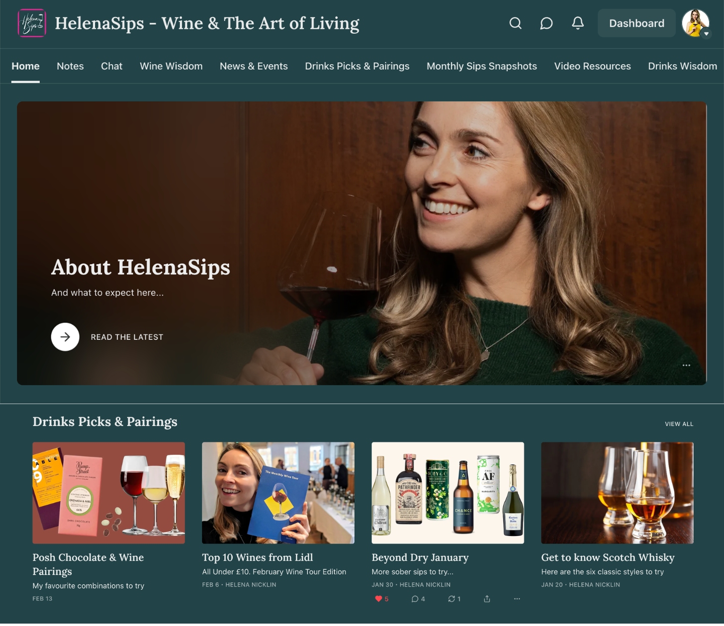 Helena holding a glass of red wine